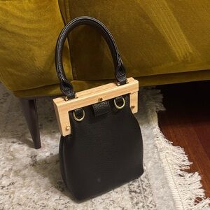 Elegant Black Handbag with Gold Accents